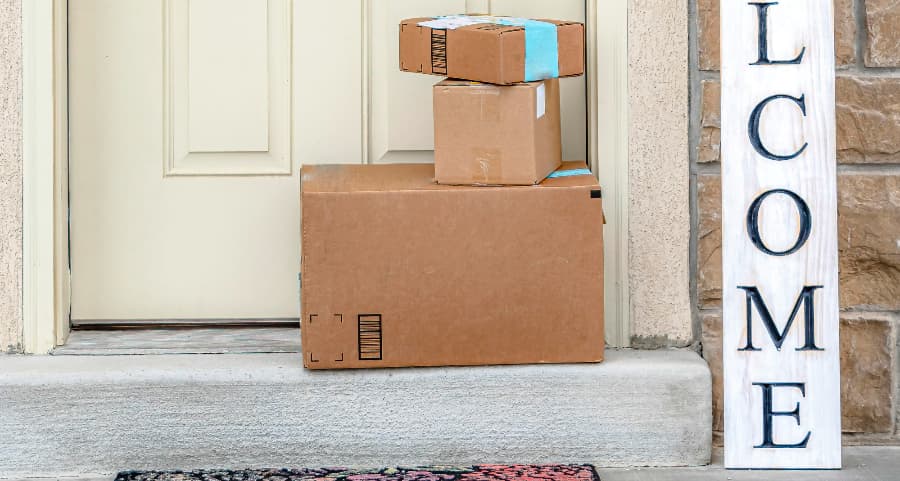 Packages on the doorstep of a home with a welcome sign in Riverside